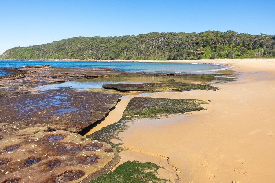 Rock platforms and sandy shoreline at Bateau Bay NSW