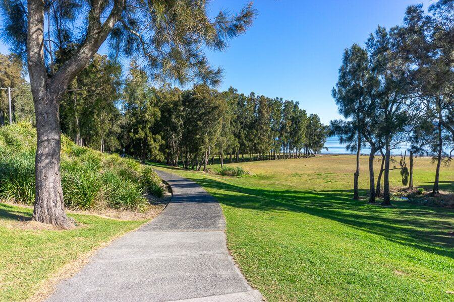 Shared walking path near the lake at The Entrance on the Coast to Lake Walk