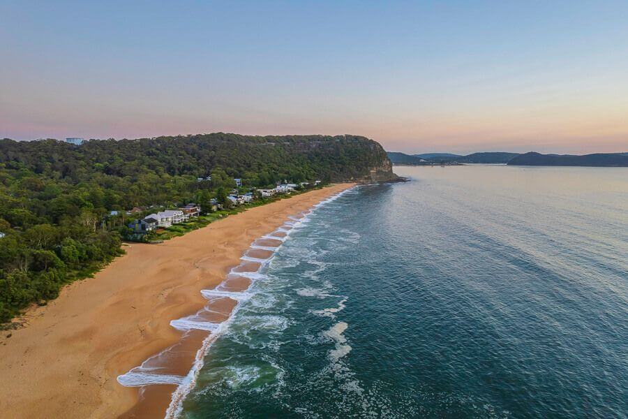 Aerial view of Pearl Beach, a dog-friendly beach on the Central Coast NSW