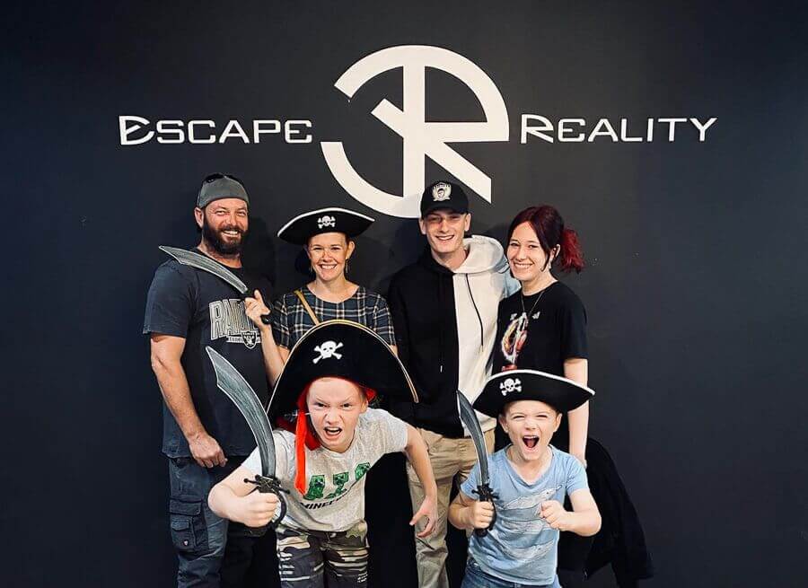 Kids and family group after completing an escape room at Escape Reality