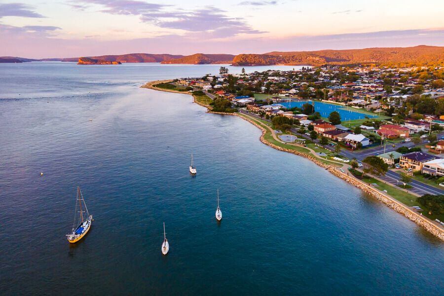 Aerial view of Ettalong Beach and Pittwater with boats at sunset