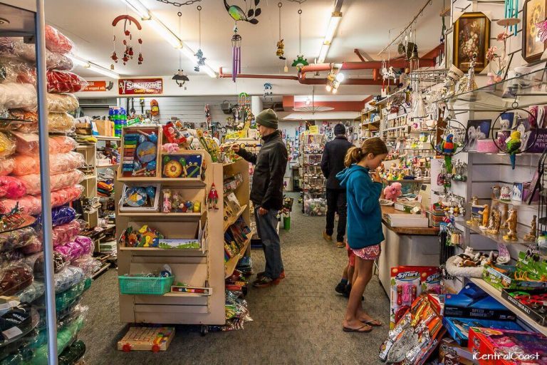 Indoor market stalls and shoppers at Ettalong Markets
