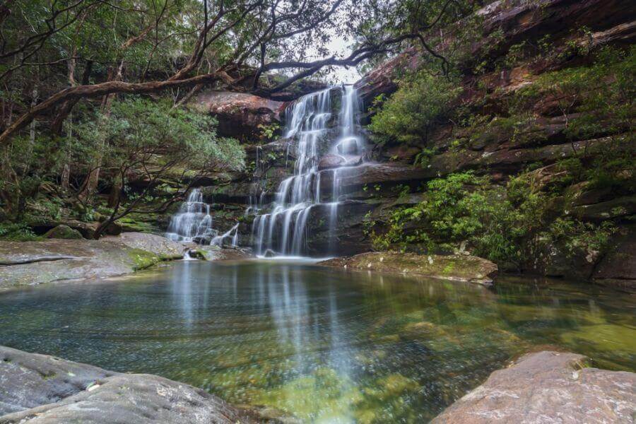 Tiered waterfall at Kariong Brook Falls surrounded by bushland