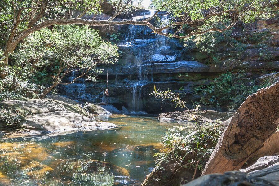 Kariong Brook Falls cascading into a natural rock pool in Brisbane Water National Park