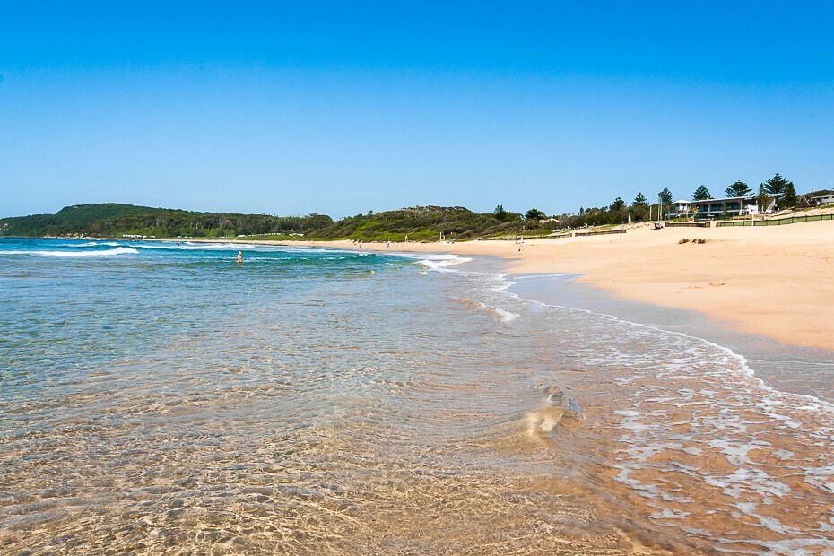 Clear shallow water and sandy shoreline at Shelly Beach on the Central Coast