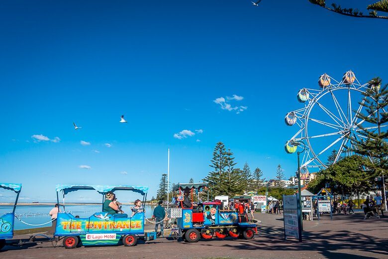 Foreshore at The Entrance with carnival rides and Ferris wheel, Central Coast NSW