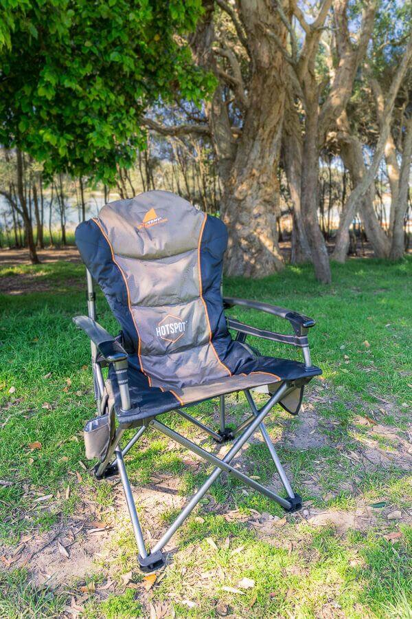 OZtent King Kokoda HotSpot camping chair set up in a park