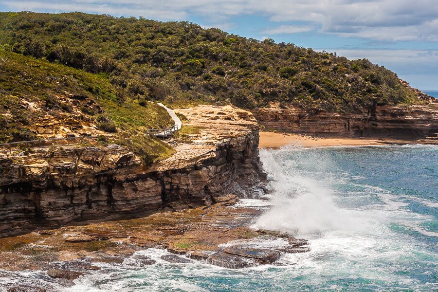 Waves crashing below the Bouddi Coastal Walk boardwalk