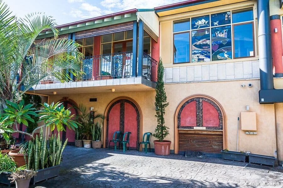 Ettalong Beach Tourist Resort exterior with courtyard and colourful façade
