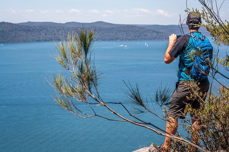 Hiker looking out over Broken Bay from Warrah Lookout