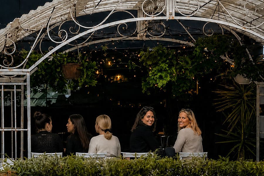 Diners seated in the outdoor dining area at Four Hands Pizza Bar in Terrigal.