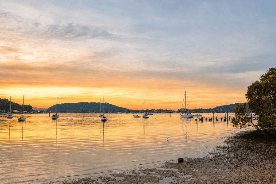 Sunset over Brisbane Water with moored boats at Hardys Bay