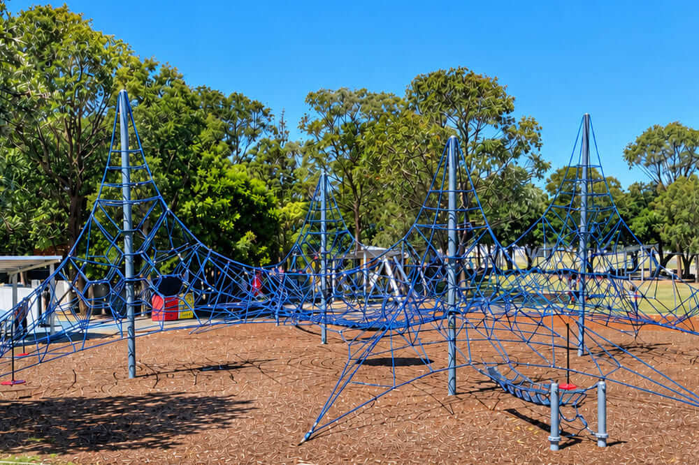 Peninsula Recreation Precinct playground in Umina with large blue rope climbing structures and slide