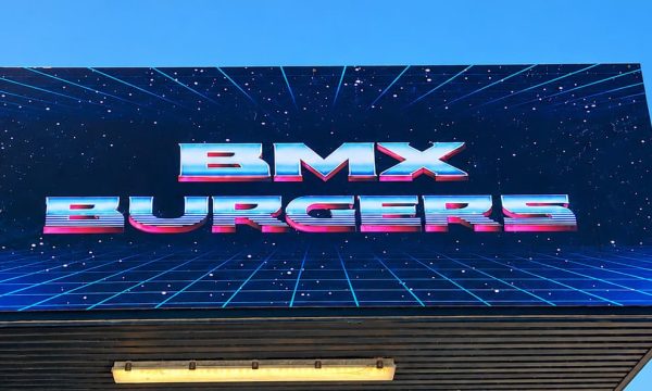 BMX Burgers in Umina Beach with a retro neon-style shop sign above the entrance