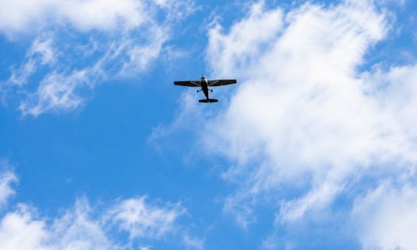 Small aircraft flying above the Central Coast during a scenic flight with Central Coast Aero Club