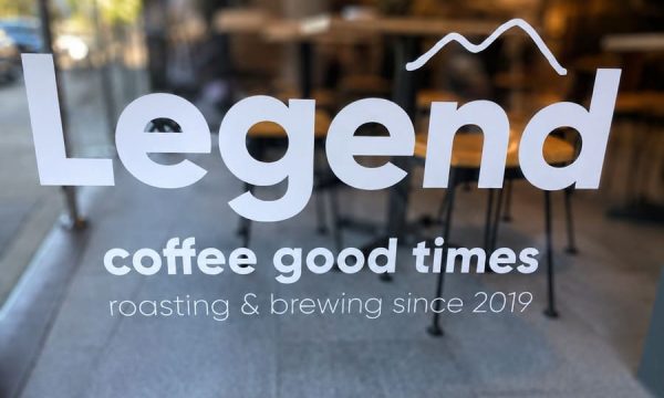 Legend Coffee logo on the front window of the Terrigal cafe