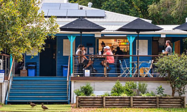 Parklife Coffee in Terrigal with outdoor deck seating, black umbrellas and bushland surroundings