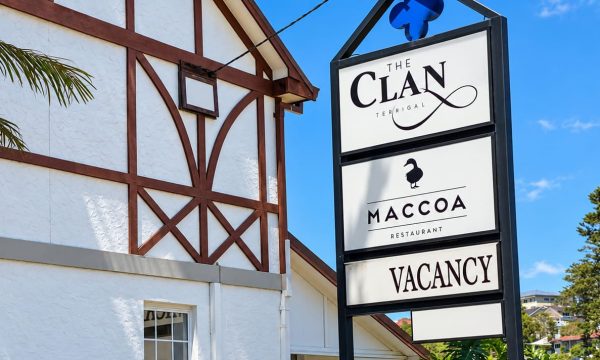The Clan Terrigal exterior with Maccoa Restaurant sign beside the building